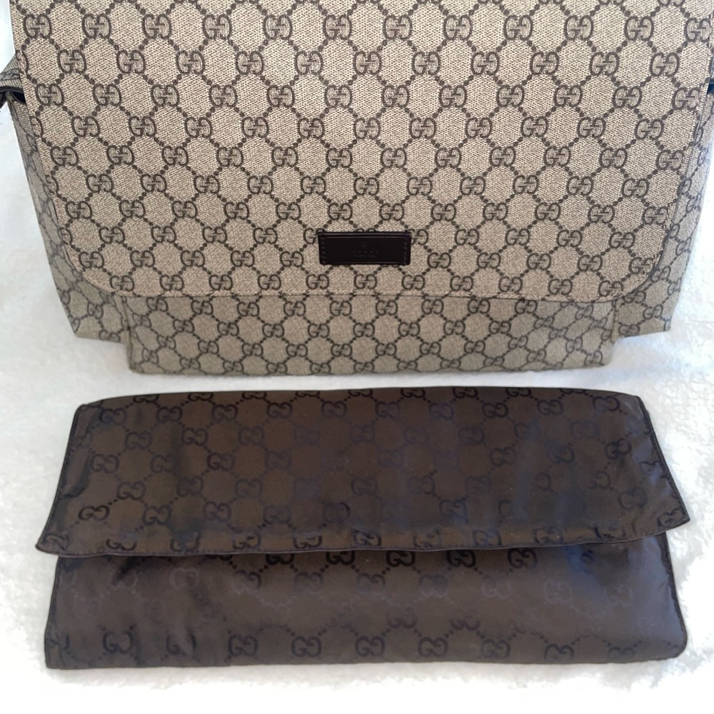 Authentic Gucci diaper bag with changing pad.